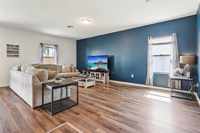 785 Orchid Grove Blvd, Davenport, FL 33837 - living area featuring wood finished floors and baseboards