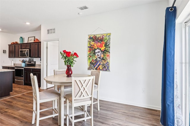 785 Orchid Grove Blvd, Davenport, FL 33837 - dining area featuring wood finished floors and recessed lighting