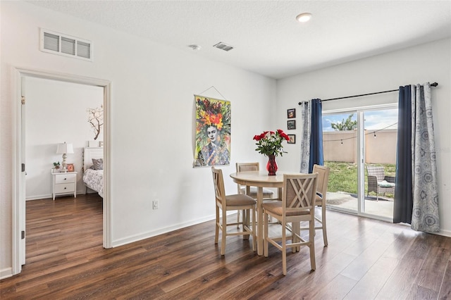 785 Orchid Grove Blvd, Davenport, FL 33837 - dining area featuring dark wood finished floors and baseboards