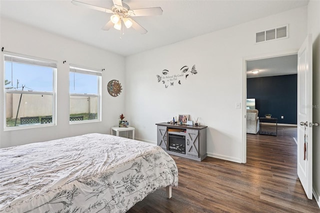 785 Orchid Grove Blvd, Davenport, FL 33837 - bedroom with wood finished floors and ceiling fan