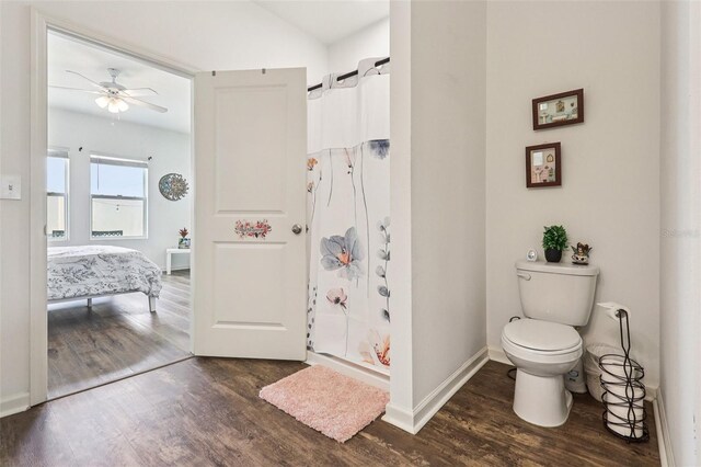 785 Orchid Grove Blvd, Davenport, FL 33837 - ensuite bathroom featuring wood finished floors, a shower with shower curtain, and a ceiling fan