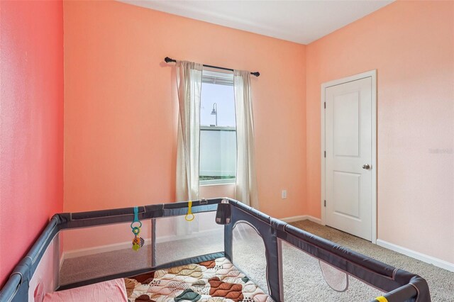 785 Orchid Grove Blvd, Davenport, FL 33837 - carpeted bedroom featuring baseboards