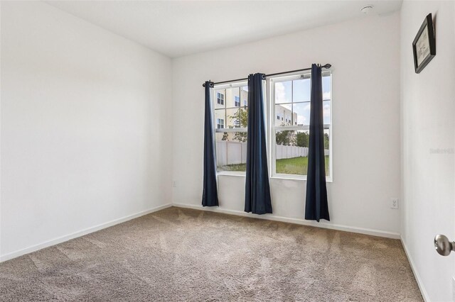 785 Orchid Grove Blvd, Davenport, FL 33837 - unfurnished room with carpet flooring and baseboards