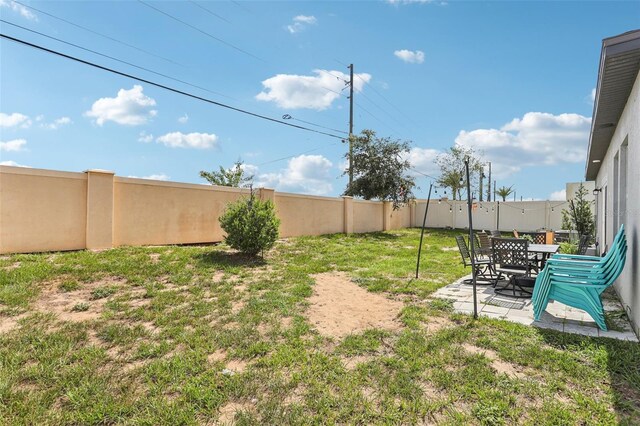 785 Orchid Grove Blvd, Davenport, FL 33837 - fenced backyard featuring a patio area