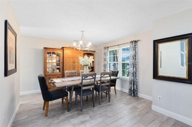 4478 Yachtmans Ct, Orlando, FL 32812 - dining room with a chandelier and light wood-type flooring