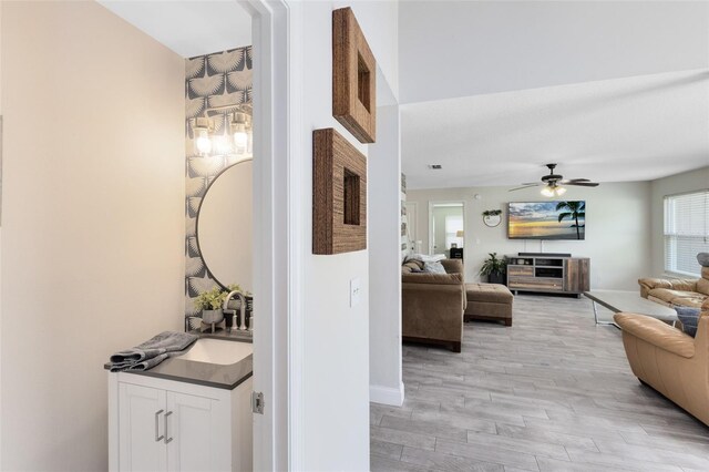 4478 Yachtmans Ct, Orlando, FL 32812 - living room featuring light wood-style floors and ceiling fan