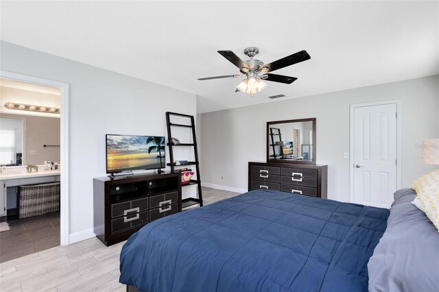 4478 Yachtmans Ct, Orlando, FL 32812 - bedroom featuring wood finished floors, ensuite bathroom, and ceiling fan