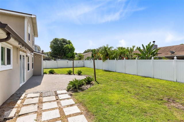 4478 Yachtmans Ct, Orlando, FL 32812 - fenced backyard with a patio area