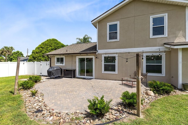 4478 Yachtmans Ct, Orlando, FL 32812 - rear view of property featuring stucco siding, a patio, and a shingled roof