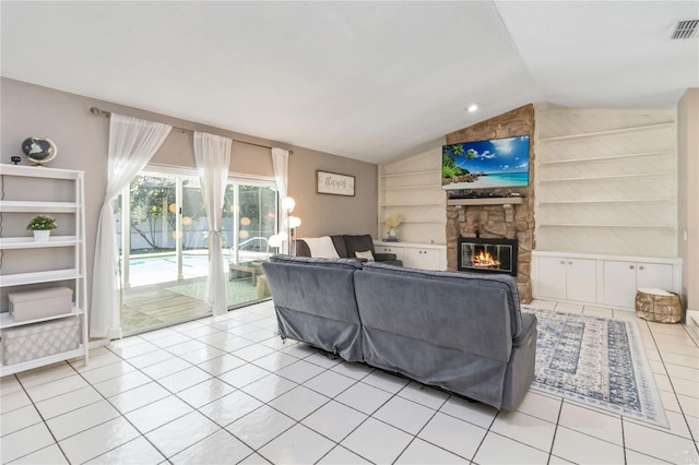 205 Stevenage Dr, Longwood, FL 32779 - living room with vaulted ceiling, light tile patterned floors, built in shelves, and a stone fireplace