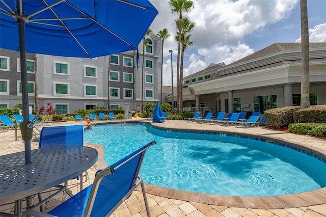 8303 Palm Pkwy Unit 402, Orlando, FL 32836 - community pool featuring a patio
