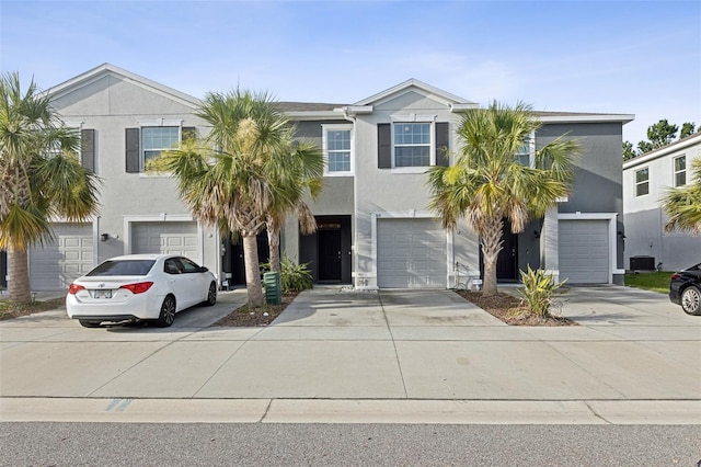 819 Lucent Sands Ct, Brandon, FL 33511 - view of front of house featuring an attached garage, concrete driveway, and stucco siding