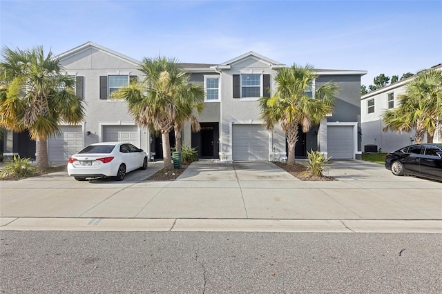 819 Lucent Sands Ct, Brandon, FL 33511 - view of front of home with an attached garage, driveway, and stucco siding