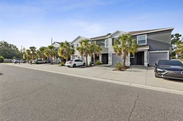 819 Lucent Sands Ct, Brandon, FL 33511 - view of front facade with stucco siding, an attached garage, and concrete driveway