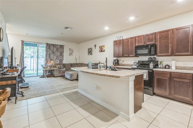 819 Lucent Sands Ct, Brandon, FL 33511 - kitchen with black microwave, range with electric cooktop, light carpet, light countertops, and open floor plan