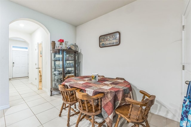 819 Lucent Sands Ct, Brandon, FL 33511 - dining area featuring arched walkways and light tile patterned floors