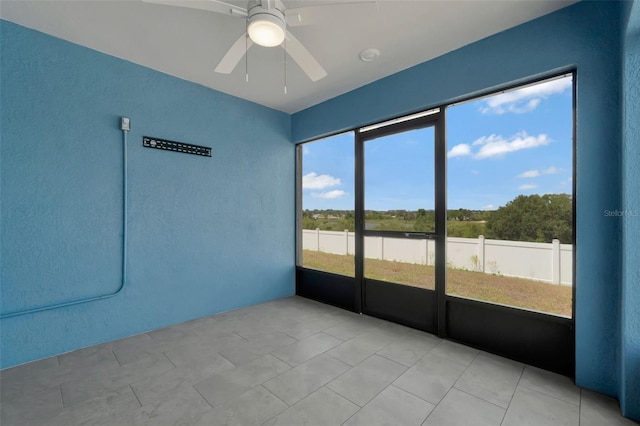 1159 Mountain Flower Ln, Davenport, FL 33837 - unfurnished sunroom with a ceiling fan