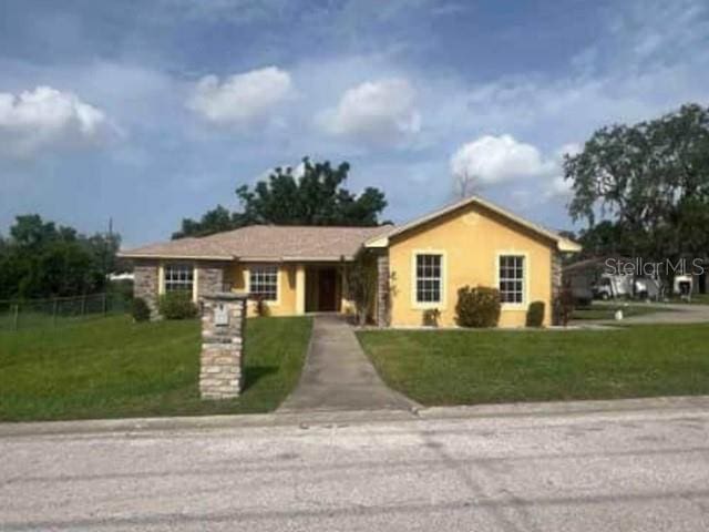 705 N 6th St, Haines City, FL 33844 - ranch-style home with stucco siding