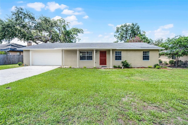 1011 W 13th St, Lakeland, FL 33805 - single story home featuring concrete driveway, an attached garage, brick siding, and a chimney