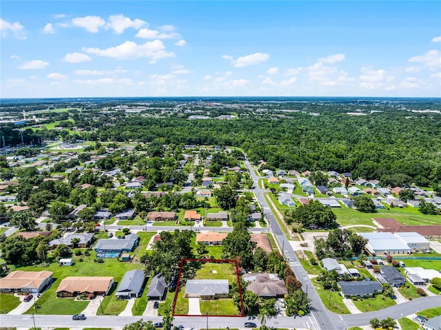 1011 W 13th St, Lakeland, FL 33805 - aerial perspective of suburban area featuring property parcel outlined