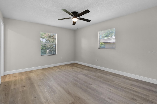1011 W 13th St, Lakeland, FL 33805 - spare room with light wood-style flooring, ceiling fan, and a textured ceiling