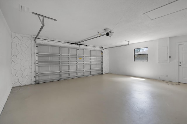 1011 W 13th St, Lakeland, FL 33805 - garage featuring a garage door opener