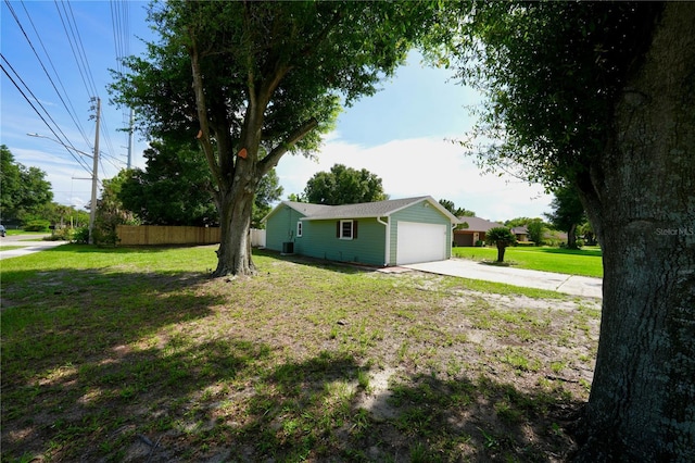5472 E Grant St, Orlando, FL 32812 - view of yard featuring driveway and an attached garage