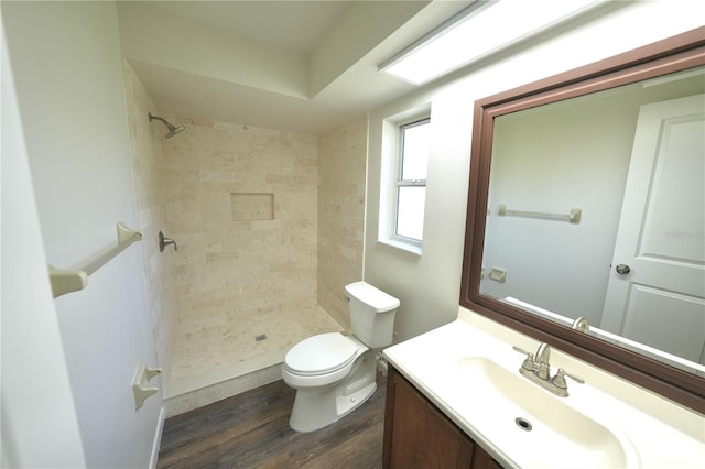 5472 E Grant St, Orlando, FL 32812 - bathroom with vanity, wood finished floors, and a tile shower