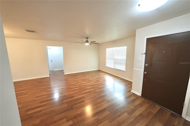 5472 E Grant St, Orlando, FL 32812 - empty room featuring wood finished floors, ceiling fan, and a textured ceiling