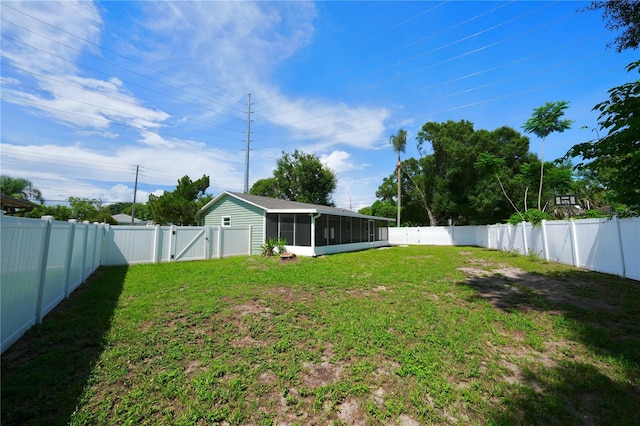 5472 E Grant St, Orlando, FL 32812 - fenced backyard featuring a gate and a sunroom