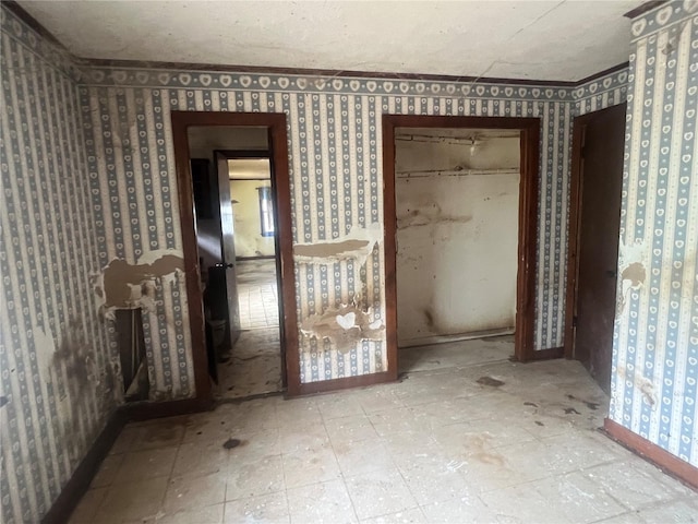 empty room with wallpapered walls