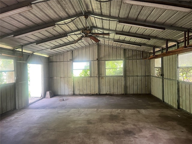 garage with ceiling fan and metal wall