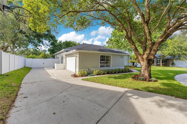 2024 Flaming Arrow Ct, Fern Park, FL 32730 - view of front of property with driveway, a garage, stucco siding, and a gate