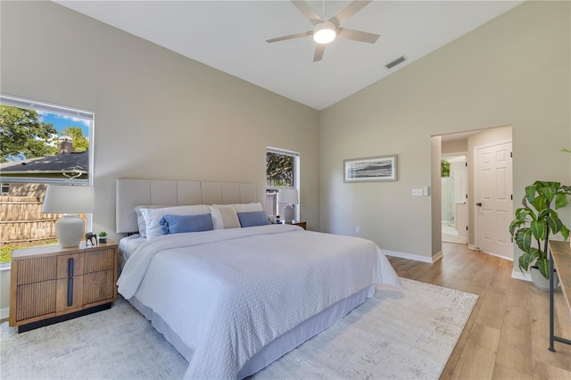 2024 Flaming Arrow Ct, Fern Park, FL 32730 - bedroom with high vaulted ceiling, multiple windows, light wood finished floors, and a ceiling fan