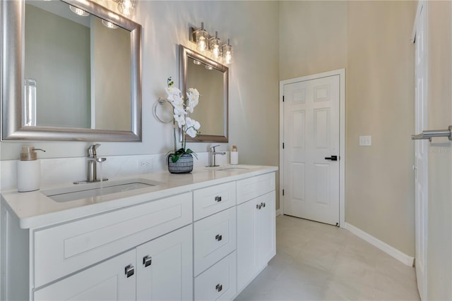 2024 Flaming Arrow Ct, Fern Park, FL 32730 - bathroom with double vanity and baseboards