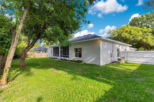 2024 Flaming Arrow Ct, Fern Park, FL 32730 - rear view of property with a sunroom, a fenced backyard, and stucco siding