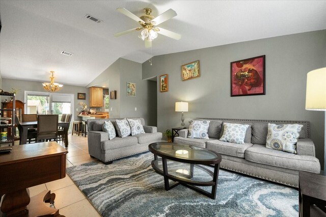 303 Mariana Way, Kissimmee, FL 34758 - living room with a chandelier, light tile patterned floors, a ceiling fan, and vaulted ceiling