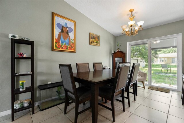303 Mariana Way, Kissimmee, FL 34758 - dining area with a chandelier, lofted ceiling, and light tile patterned floors
