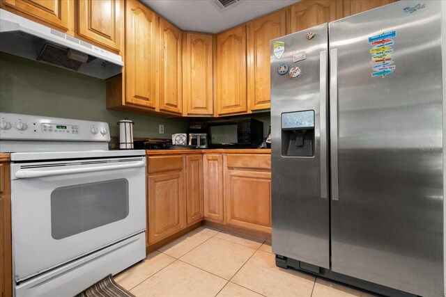 303 Mariana Way, Kissimmee, FL 34758 - kitchen featuring stainless steel refrigerator with ice dispenser, white range with electric stovetop, under cabinet range hood, light tile patterned flooring, and dark countertops