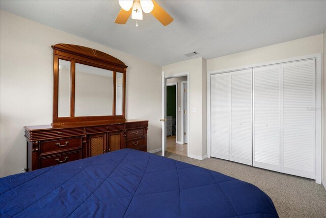 303 Mariana Way, Kissimmee, FL 34758 - carpeted bedroom featuring a closet and a ceiling fan