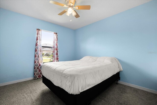 303 Mariana Way, Kissimmee, FL 34758 - carpeted bedroom featuring baseboards and a ceiling fan
