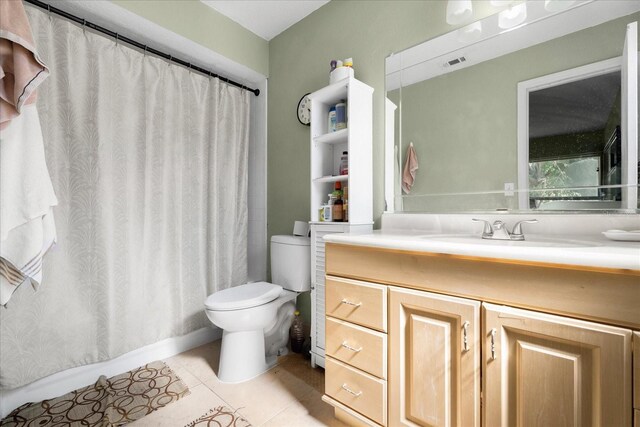 303 Mariana Way, Kissimmee, FL 34758 - bathroom featuring tile patterned flooring, vanity, and a shower with curtain