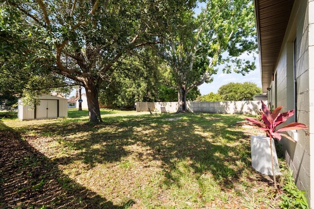 303 Mariana Way, Kissimmee, FL 34758 - view of yard featuring a storage shed