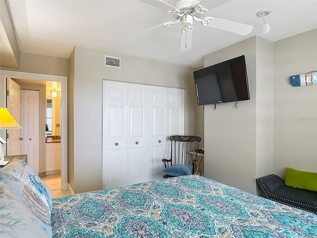2055 S Atlantic Ave Unit 1410, Daytona Beach Shores, FL 32118 - bedroom featuring a closet, light tile patterned floors, and ceiling fan
