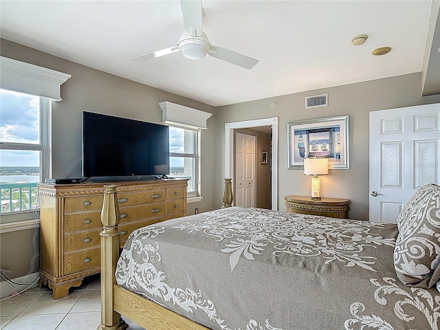 2055 S Atlantic Ave Unit 1410, Daytona Beach Shores, FL 32118 - bedroom with light tile patterned floors and ceiling fan