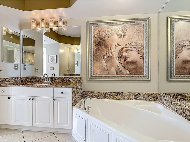 2055 S Atlantic Ave Unit 1410, Daytona Beach Shores, FL 32118 - bathroom featuring vanity, a garden tub, and tile patterned floors
