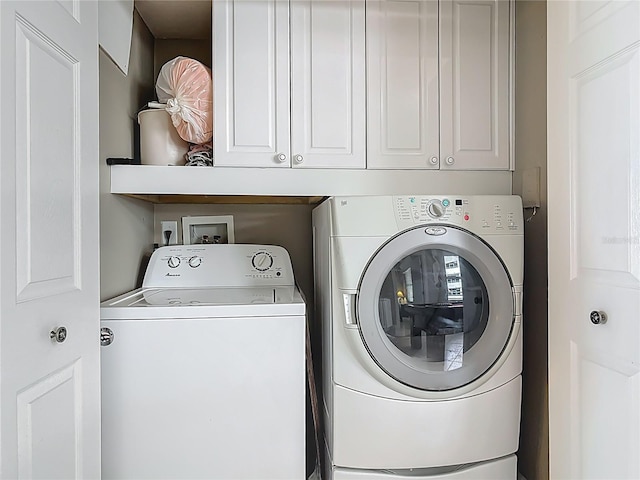 2055 S Atlantic Ave Unit 1410, Daytona Beach Shores, FL 32118 - washroom featuring separate washer and dryer and cabinet space