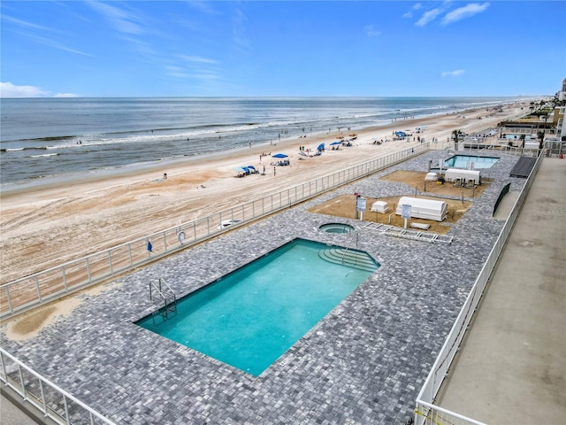 2055 S Atlantic Ave Unit 1410, Daytona Beach Shores, FL 32118 - community pool featuring a hot tub and view of water and beach