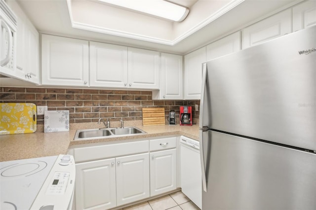 2400 Forest Dr Unit 219, Inverness, FL 34453 - kitchen with white appliances, light countertops, white cabinets, and decorative backsplash