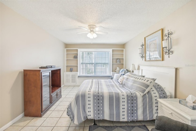 2400 Forest Dr Unit 219, Inverness, FL 34453 - tiled bedroom with a textured ceiling and a ceiling fan
